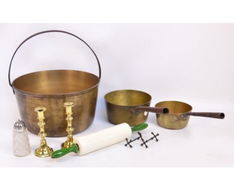 A quantity of kitchenalia including a jam pan, vintage saucepans, brass candlesticks, rolling pin, etc.