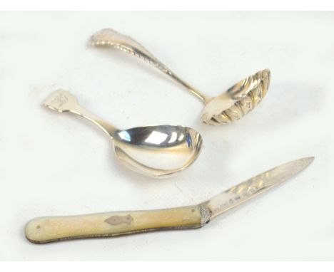 A George IV hallmarked silver fiddle pattern caddy spoon, London 1833, a George V hallmarked silver sifting spoon, Birmingham