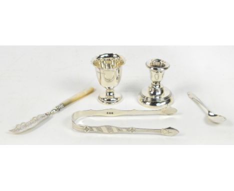 A small group of hallmarked silver comprising a pair of bright cut decorated sugar tongs engraved "AR to HL", Peter & William