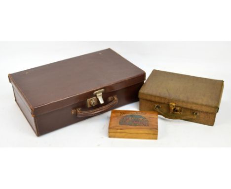 A vintage small leather suitcase with carrying handle, width 41cm, a green leather vanity/needlework case with carrying handl