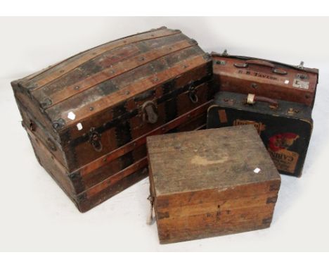 A vintage strap bound domed trunk, a leather suitcase, a further suitcase and a metalbound box (4).