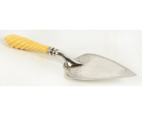 An Edward VII hallmarked silver presentation trowel with twisted decorated ivory handle, engraved with foliate scrolls, Hasel