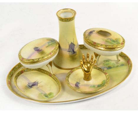 A Noritake six piece dressing table set comprising an oval tray, a small oval trinket bowl, a ring stand, a hat pin holder an