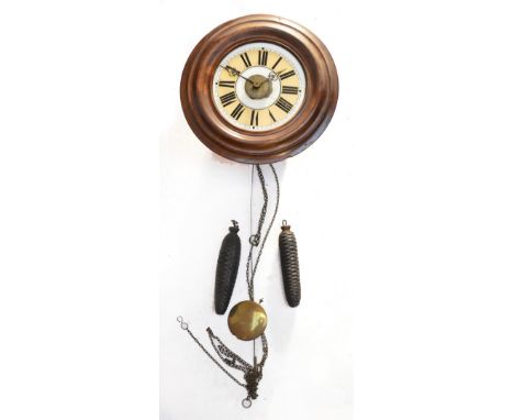 A mahogany thirty hour postman's alarm clock, the glass dial set with Roman numerals, diameter 30cm.