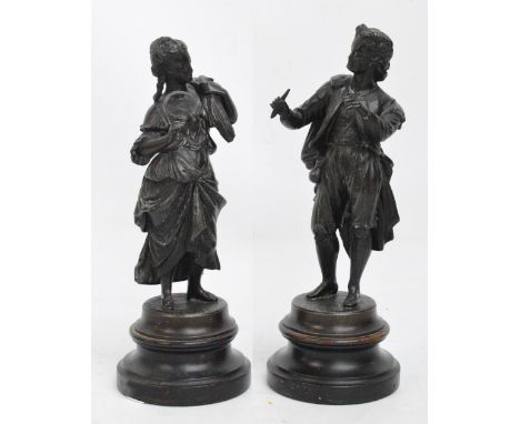 A pair of late 19th century spelter figures modelled as a young woman with corn over her shoulder, the companion modelled as 