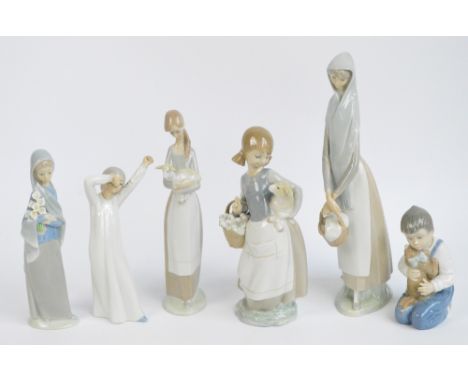 Four Lladro figures; tall girl with a basket, girl with lamb and basket of onions, girl with lamb and girl with a sheaf of fl