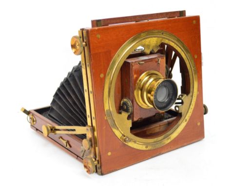 A Thornton-Pickard wooden framed brass mounted large format plate bellows camera inscribed "Triple Victo" with Beck symmetric