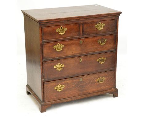 a George III oak chest of drawers, the moulded rectangular top above two short and three long graduated drawers on bracket fe