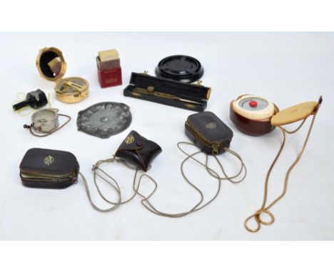 A small quantity of scientific items including a number of light meters, a volt meter, a brass cased compass, a set of Tables