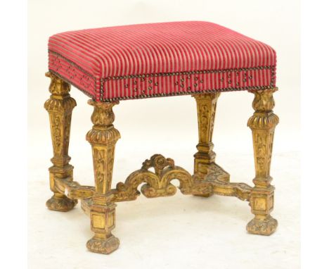 A 19th century giltwood framed dressing stool, the stud decorated upholstered top above four square section tapering legs uni