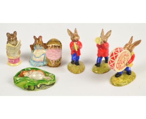 Three 1984 Royal Doulton Bunnykins band figures; DB26 "Drummer Bunnykins", DB24 "Trumpeter Bunnykins", and DB25 "Cymbals Bunn