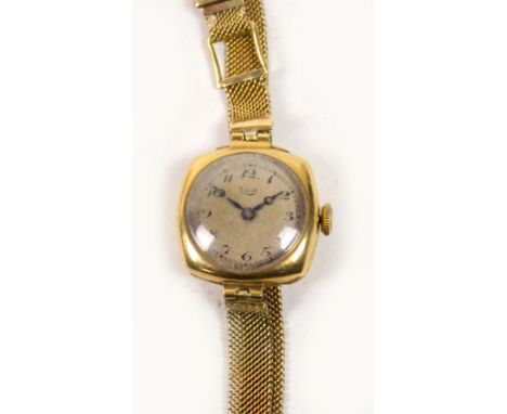 LIMIT; a lady's 9ct yellow gold cased manual wind wristwatch, the case stamped "Dennison", the silvered circular dial set wit