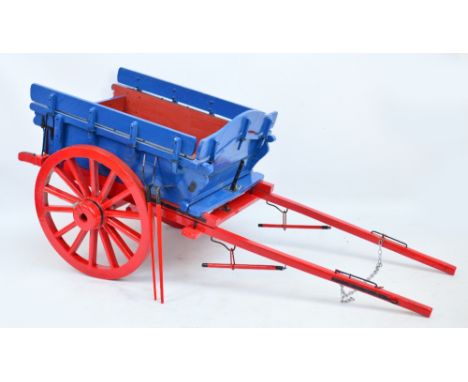 A scratch built model Scotch Cart painted in blue and red, length 100cm.