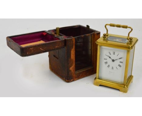 A c.1900 French brass cased carriage clock with rectangular white enamel dial set with Roman numerals and inscribed "Furber &