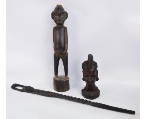 A large carved African fertility figure with rope hair on a circular plinth, height 66cm, a carved African female head with i