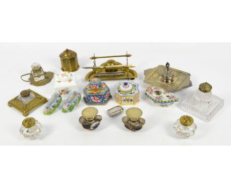 A collection of predominantly glass and metal mounted inkwells, a small group of ceramic examples including a hand painted We