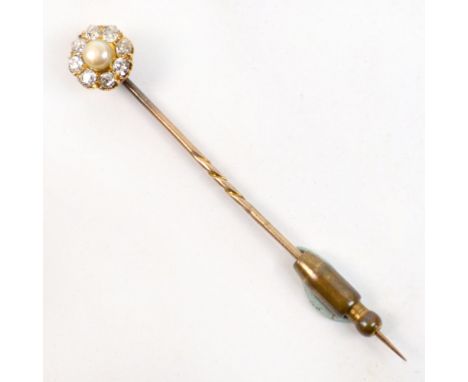 A yellow metal diamond and pearl stick pin, the floral head centred with a cultured pearl within a border of eight diamonds e