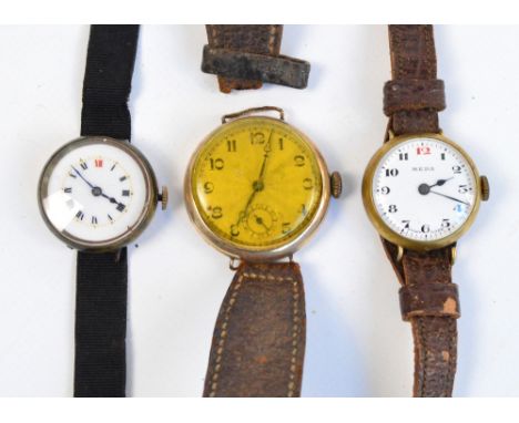 A distressed 9ct gold lady's fob watch converted to wristwatch (badly af), a gold plated wristwatch with circular dial set wi