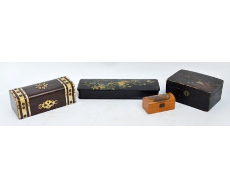 A collection of boxes comprising a simulated rosewood strap bound trinket box, a small Mauchline ware box, with domed top and