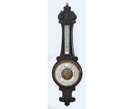 An early 20th century carved dark oak banjo wall barometer, the circular dial inscribed "Lloyd, Payne and Amiel Manchester" u