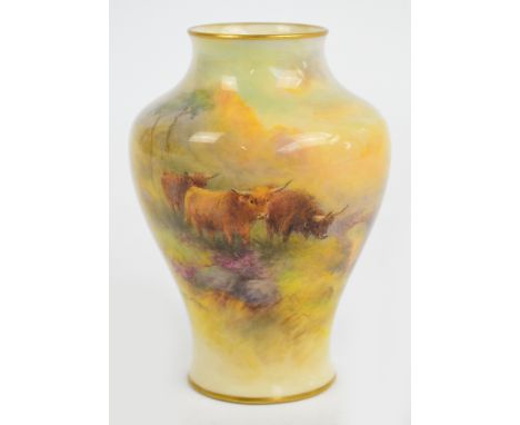 A Royal Worcester baluster vase hand painted with Highland cattle in a landscape behind a river with bridge, signed "H. Stint