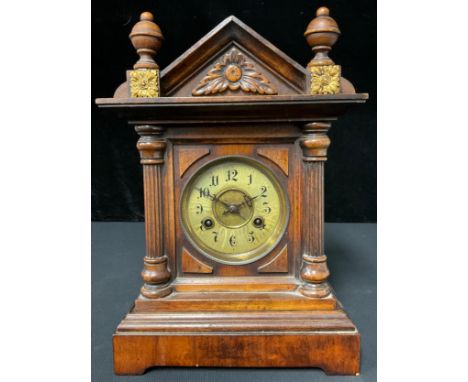 A Victorian walnut cased mantel clock 