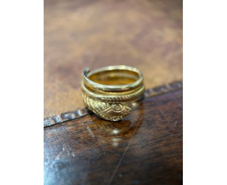 A gold coloured metal snake ring, engraved with chevrons forming the snakes skin, probably 9ct gold, size K/L, 4.5g 