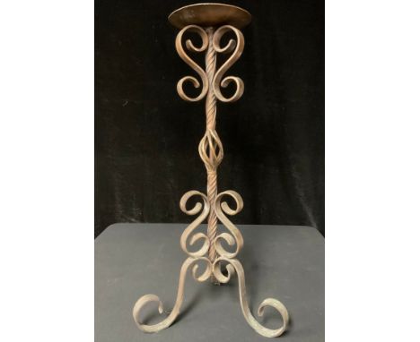 A planished and wrought copper pricket stick, 70cm 