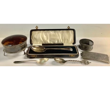 A late Edwardian silver rounded rectangular visiting card case, engraved with foliate scrolls, vacant central shield shaped c