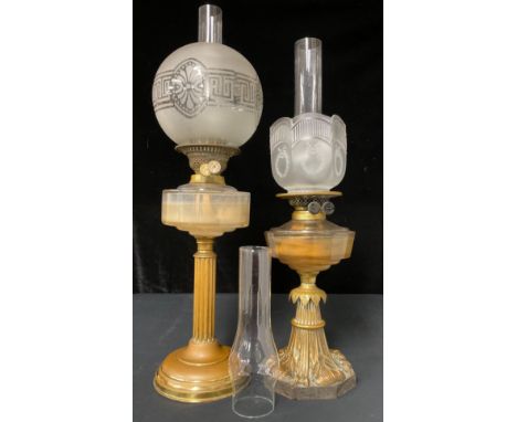 A 19th century brass and moulded glass oil lamp, on stepped circular base, the reeded stem terminating in a stepped capital, 