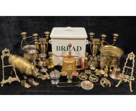 A pair of brass two branch candlesticks; another pair similar; a brass heavy gauge piggy bank; an enamel bread bin and cover;