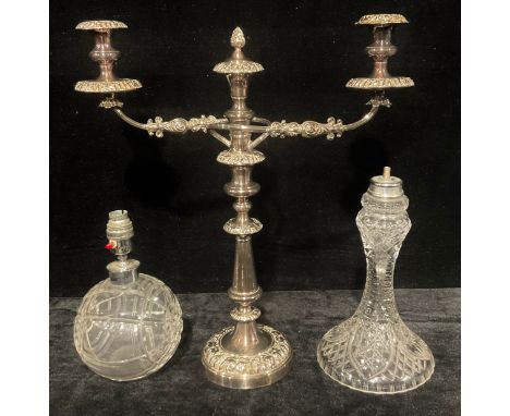 A plated three light, two branch candelabrum, 50cm high; a mid 20th century cut glass spherical table lamp; another cut glass