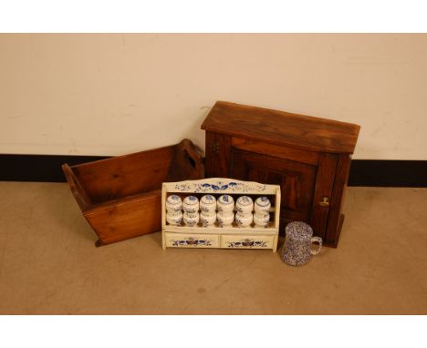 A French wooden white painted spice rack with six pottery spice shakers, together with a small oak cabinet, a trough and a po