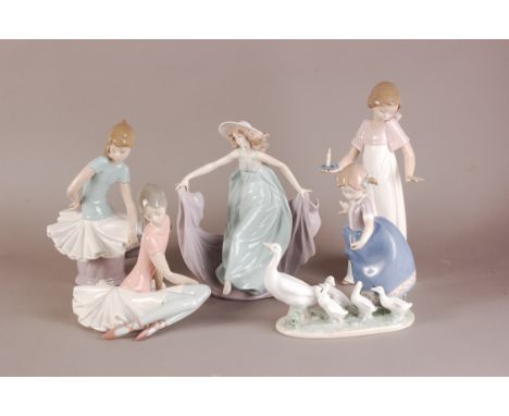 Four modern Lladro porcelain figures, including two ballerina girls, a young girl with ducks, and an elegant lady, together w