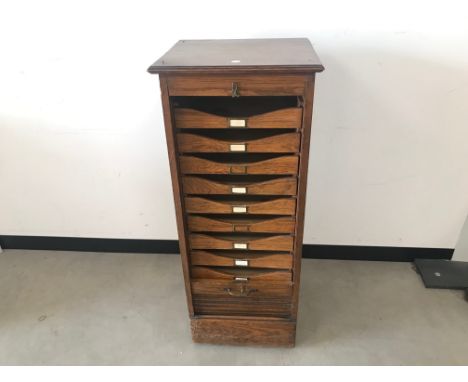 An Art Deco period oak tambour front filing cabinet, AF, 115cm high, top loose and tambour detached 
