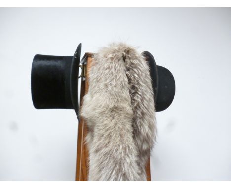 An Art Deco period oak coat stand, of four sided tapering form, 180cm tall, together with a fur shawl and muff, a top hat by 