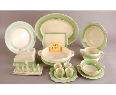 An Art Deco period Newport Pottery and Royal Staffordshire part dinner service by Clarice Cliff, including two tureens, one w