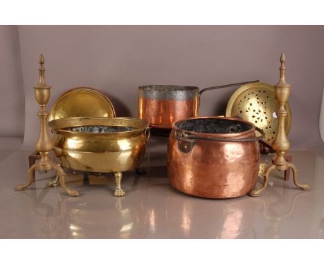A collection of 19th and 20th century copper and brass items, including two bed pans, a pair of fire dogs, two copper pans, b