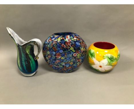 Three late 20th century items of art glass, including a flattened millefiori style vase, 39cm, a jug and a bright bowl with f