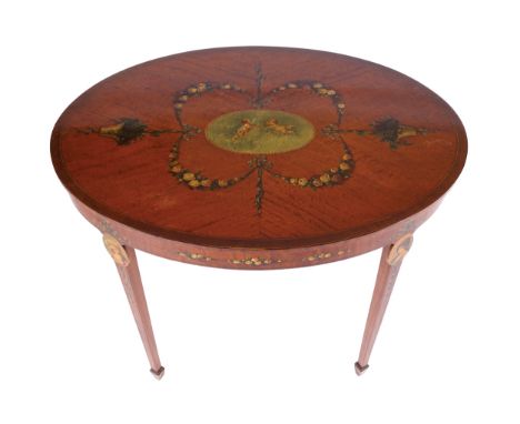 EDWARDIAN PERIOD SATINWOOD AND CROSSBANDED OCCASIONAL TABLE, CIRCA 1900the cherub and floral painted oval shaped top, above a