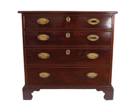 SMALL GEORGE III PERIOD MAHOGANY  CHESTof four drawers furnished with oval brass handles, raised on bracket feet    85 cm. hi