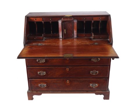 GEORGE III PERIOD MAHOGANY BUREAUthe rectangular top above a fall front, opening to a comprehensive fitted writing interior, 