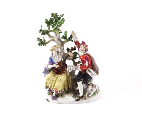 MEISSEN PORCELAIN GROUP of figures in a garden, the lady playing a mandolin, the young man standing with a lamb at his feet30