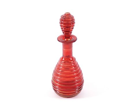 NINETEENTH-CENTURY RUBY GLASS DECANTER AND STOPPERwith ribbed decoration18 cm. high