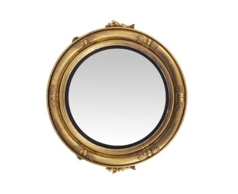 LARGE REGENCY PERIOD GILT FRAMED CONVEX MIRROR, CIRCA 1820the circular convex plate within an acanthus leaf tied moulded fram