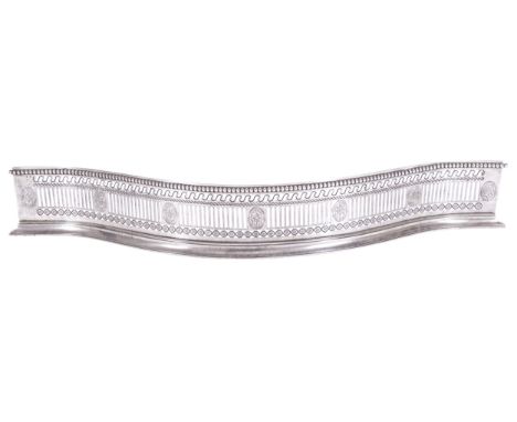 DUBLIN GEORGE III PERIOD POLISHED STEEL AND BRIGHT CUT SERPENTINE FIRE FENDER, CIRCA 1790with pierced panels centred on pater