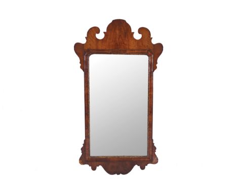 EIGHTEENTH-CENTURY PERIOD WALNUT FRAMED PIER MIRROR, CIRCA 1740the rectangular plate with serpentine corners to the top, with