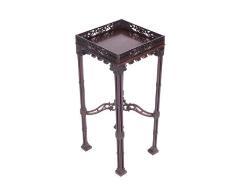 GEORGE III PERIOD CHIPPENDALE URN STAND, CIRCA 1790the square top with a pierced fretwork gallery rail, above a fretwork frie