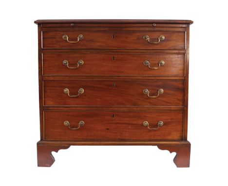 GEORGE III PERIOD MAHOGANY BACHELOR_S CHESTof four drawers furnished with brass scroll handles, below a brushing slide, raise