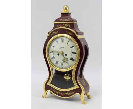 Tischuhr, Schmid Schlenker Schwenningen 2. H. 20. Jh., in Form einer Neuenburger-Pendule, Holzgehäuse, Bordeauxrot gefasst u.